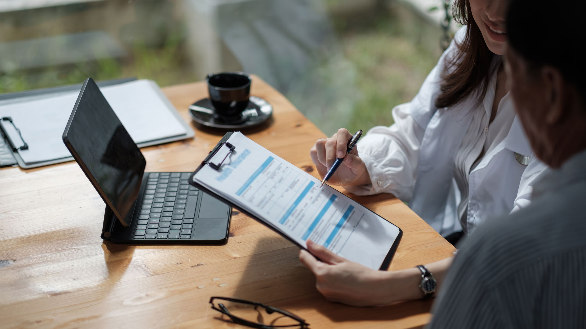 Female health insurance broker presenting his insurance benefits to businessman fill out insurance policy. To prevent future incidents