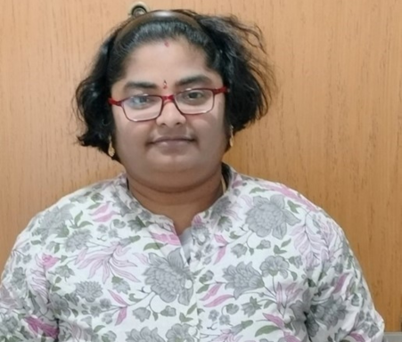 headshot of women wearing glasses