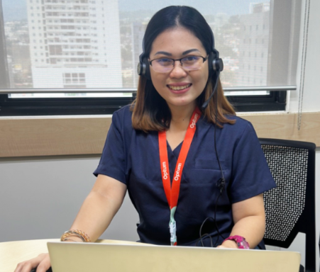 women wearing headset at desk 