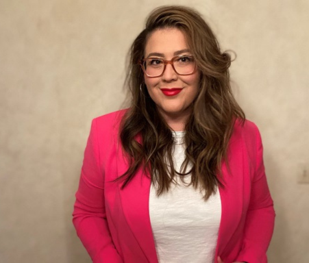 headshot of women wearing glasses